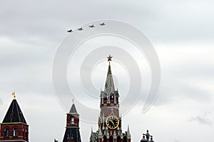 MIG-29 SMT fighters during a parade dedicated to the 75th anniversary of Victory in World War II, fly over the Red Square in the s