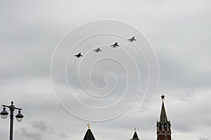 MiG-31K fighter interceptors fly in the sky over Red Square during an air parade dedicated to the 75th anniversary of Victory in t photo