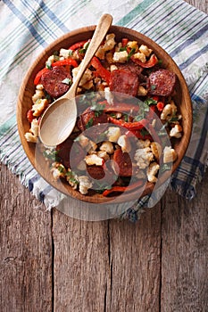 Migas with chorizo, bread crumbs and vegetables. vertical top vi