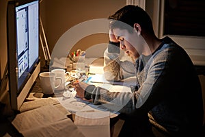 It might not be easy but itll be worth it. a young student studying late into the night.