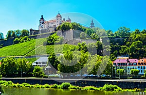 The mighty fortress Marienberg is the symbol of Wurzburg. Festung Marienberg rises above the River Main and vineyards on the