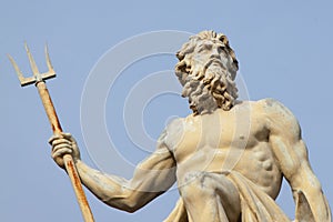 The mighty god of sea and oceans Neptune Poseidon, Triton with trident as symbol strength, power and unrestraint. Close up an photo