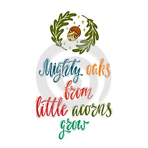 Mighty oaks from little acorns grow. Handwritten inspirational quote with acorn and oak leaves. photo