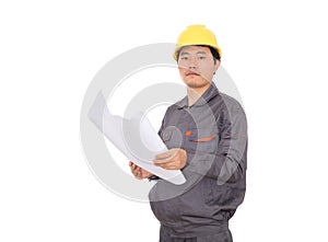 Migrant worker wearing yellow hard hat holding drawings in hand in front of white background