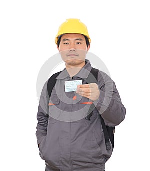 Migrant workers carrying schoolbags and wearing yellow helmets holding train tickets to go home for the New Year