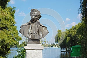 Mihai Eminescu statue in Herastrau park Bucharest Romania photo