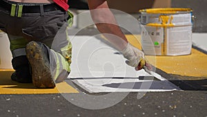 Mikhailovsk, Stavropol region, Russia - April 25 2022: road works. painting of a pedestrian crossing. Road repair