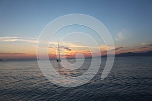 Mikonos beautiful sunset light. Boat. Greece