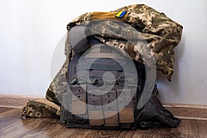 Mil grey bulletproof vest with banner of ukrainian flag and jacket.