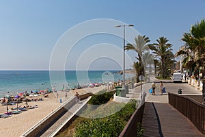 Mil Palmeras Spain with people on the beach and palm trees photo