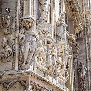 Milan Cathedral Duomo di Milano close-up, Milan, Italy. Detail of luxury facade with many marble statues and reliefs. Milan
