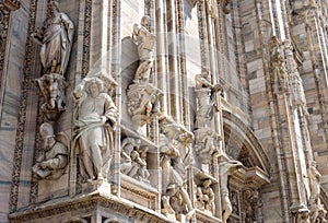 Milan Cathedral Duomo di Milano closeup, Milan, Italy. Detail of luxury facade with many marble statues and reliefs