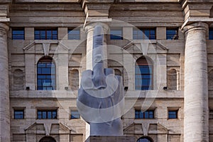 Milan - Cattelan L.O.V.E. sculpture (Il dito), the giant middle finger statue at Piazza Affari in Milan photo
