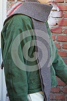 Man with long, gray wool scarf before Fendi fashion show, Milan Fashion Week street style