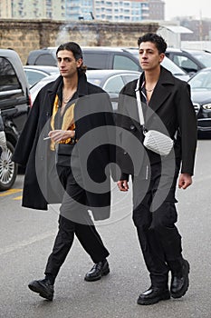 Men with black jacket and trousers before Prada fashion show, Milan Fashion Week street style