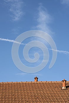 Milan Italy: tiled roof and two chimneys