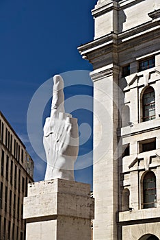Sculpture of Cattelan`s finger in front of the Milan Stock Excha photo