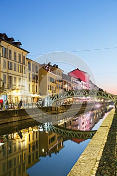 Milan Navigli Milano restaurant and bar district travel traveling holidays vacation town blue hour portrait format in Italy