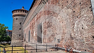 Milan - Scenic view of Corner tower of Sforza Castle (Castello Sforzesco) in the historic city center of Milan