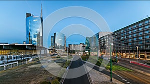 Milan skyline with modern skyscrapers in Porta Nuova business district day to night timelapse in Milan, Italy, after