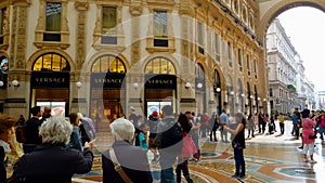 Milan tourists in shopping mall near luxury store, Galleria Vittorio Emanuele