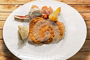 Milanese cutlet, veal cutlet with bone breaded