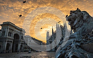 Milano piazza duomo cathedral galleria and lionmonument at sunrise cloudy sky photo