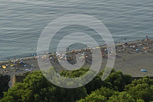 Milazzo at sicilian island beach viewed froma mountain with tourist and mediterranean sea