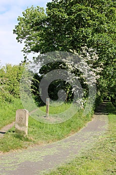 Mile post marker and footpath waymarker