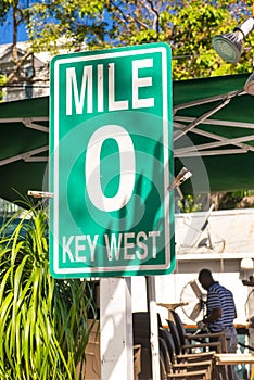 Mile Zero Key West road sign surrounded by vegetation