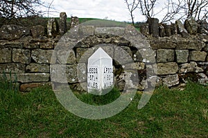 Milepost on the Leeds Liverpool Canal, East Marton, Craven District, North Yorkshire, England, UK