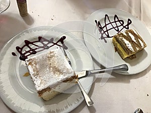 Milhojas and punch on a white plate decorated with strawberry syrup, typical desserts of Spanish gastronomy photo