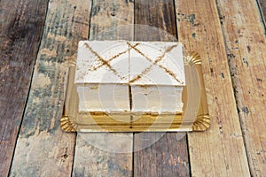 Milhojas, in Spain, is a rectangular-shaped cake, which contains meringue photo