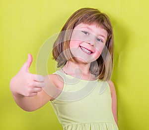 Miling girl with thumbs up