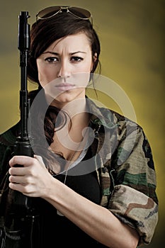 Militarized Young Woman WIth Assault Rifle