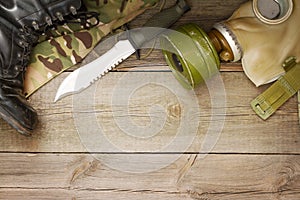 Military accessories on wooden boards