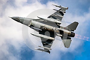 Military air force fighter jet interceptor airplane in full flight photo
