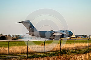 Large airliner just before landing in the evening at sunset.