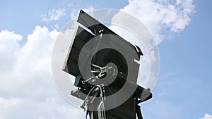 Military airport radar dish always monitoring and rotating.