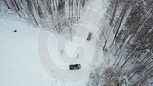 Military armored personnel carriers in the woods during military exercises. Clip. Top view of military armored personnel