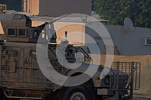 Military army vehicle close up of guns and military personel aiming and shooting.  Military and war concept of power, force,