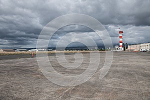 Military base airport runway with control tower.