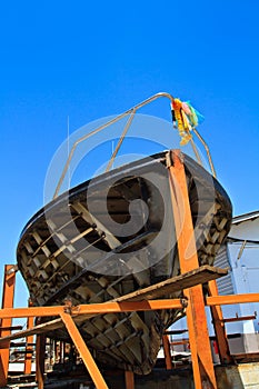 Military boat on repair in dry dock