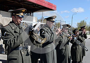 A military brass band marching on the parade ground of the internal troops.