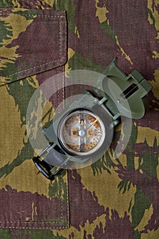 Military camo pants and compass