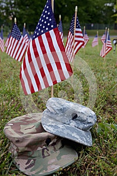 Military cap and american flags