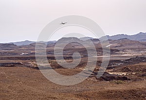 Military Cargo Transport Aircraft Flying Low over the Makhtesh Ramon Crater in Israel