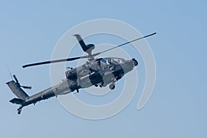 Military chopper in war flies through the sky. Military concept of power, force, strength, air raid