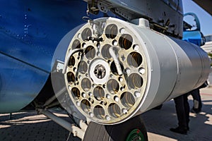 Military combat helicopter side gun or cannon, detail view from behind with tube holes for ammunition