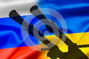 Military conflict between Russia and Ukraine, A gun against the background of two state flags of the warring states